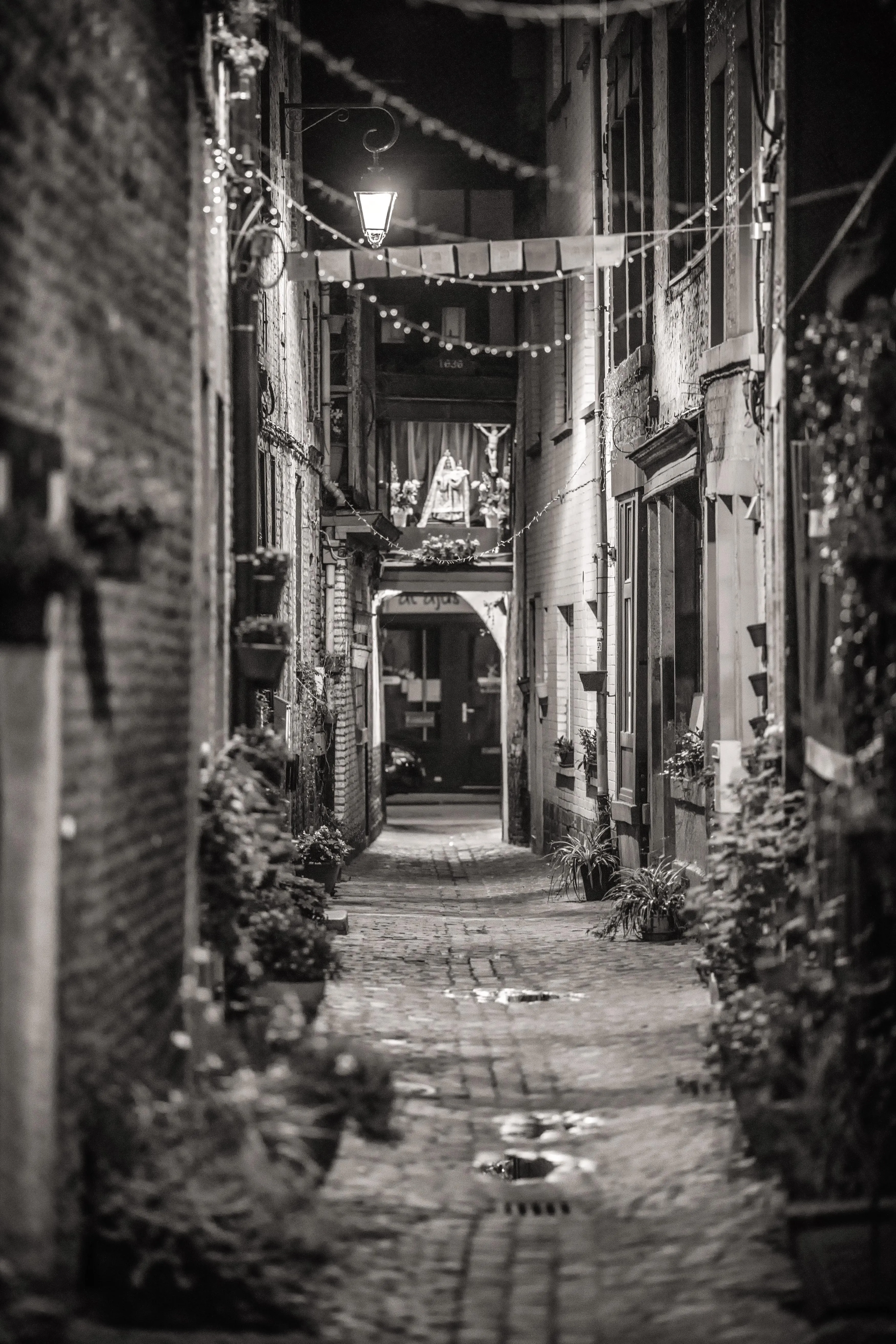 Cobbled alley and votive niche, old Liège